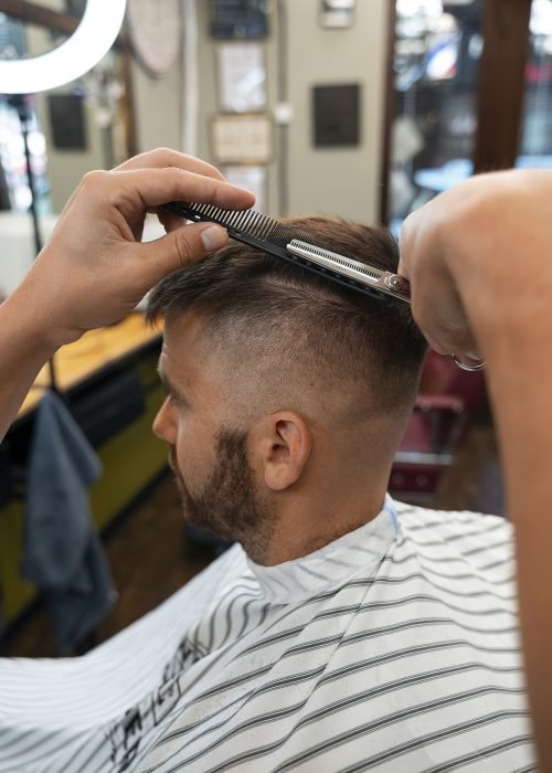 side-view-man-getting-haircut